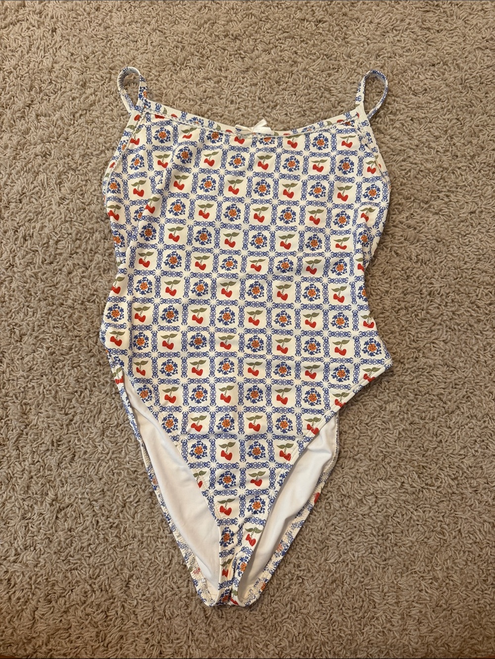 Dippin' Daisy's Cream One-Piece Swimsuit with Blue Tile and Red Accent